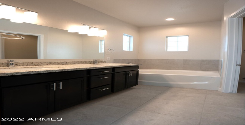 Granite sink counters. Relaxing soaking tub.