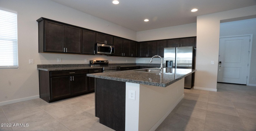 Beautiful granite counters, SS appliances, upgraded cabinetry. Built in microwave. This kitchen will impress.