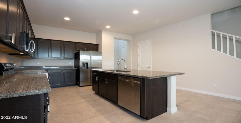 Open Kitchen. Refrigerator included in the sale of the property.