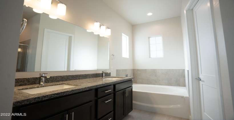 Double sink with plenty of counter space. Granite counters.