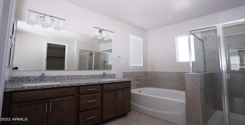 Large soaking tub. Separate shower. Double sinks with a granite counter.