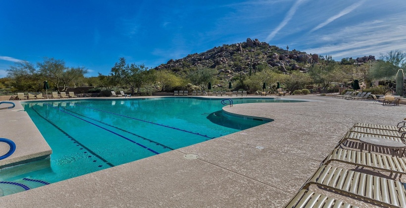 Community pool has lap lanes at one end and a beach style walk-in at the shallow end of the pool.