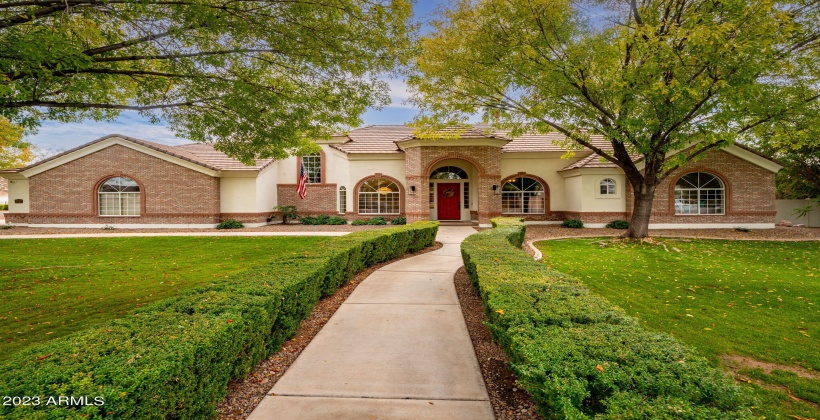 North facing with side entry garage, large beautiful trees umbrella grassy yard.