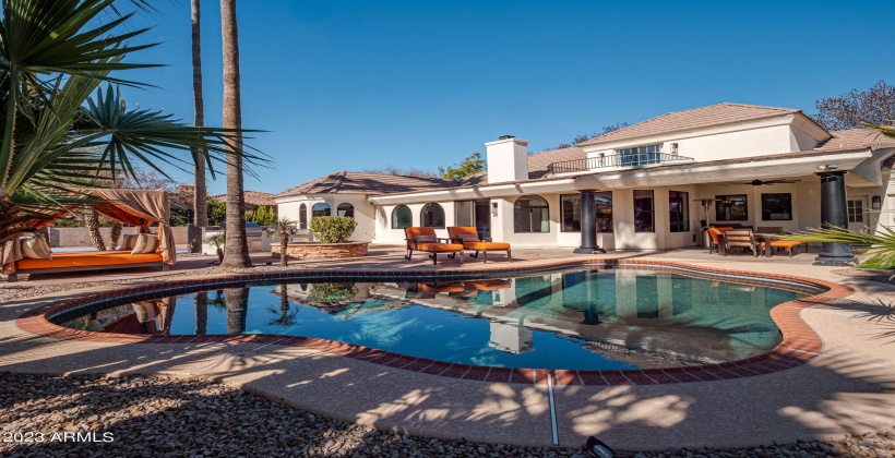 Perfect amount of shade and sun surrounding the pool space.