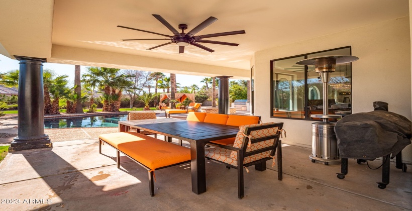 Covered and cooled with large fan for outdoor dining and pass through window.