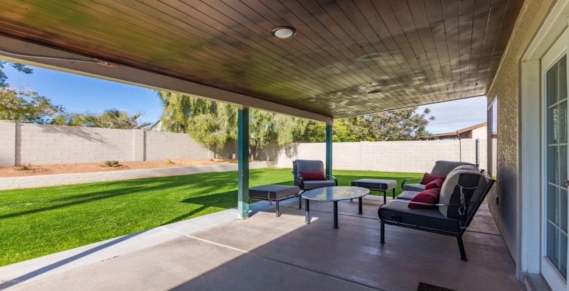 Spacious backyard with covered patio