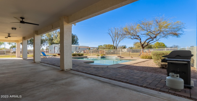 Covered back patio runs full length of home