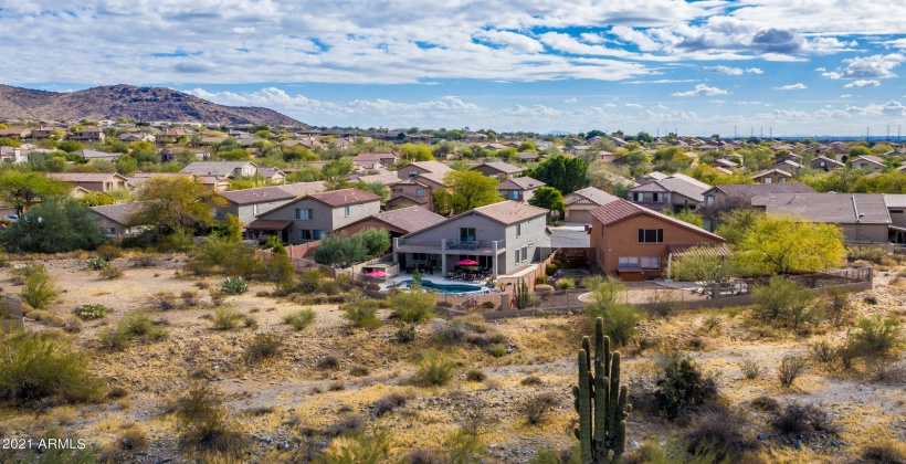 THE MIDDLE GRAY HOUSE WITH THE RED UMBRELLAS!!! NO HOMES BEHIND YOU! JUST A VIEWING FENCE BETWEEN YOU AND THE DESERT!