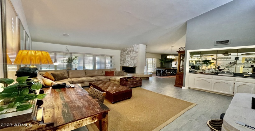 Overlooks a oversized patio area with green grass and pool.