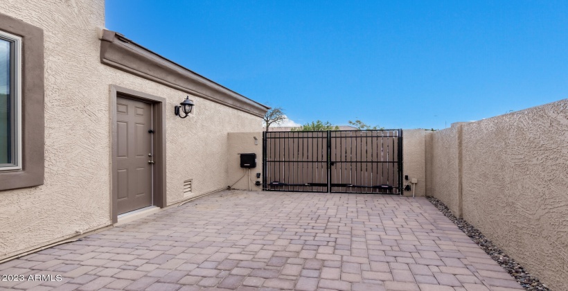 Automatic side gate to side yard pavered extra parking