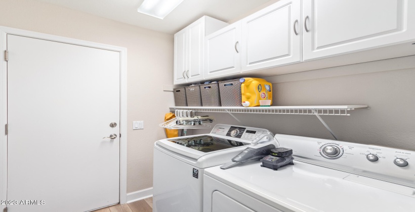 Store your laundry supplies in built cabinets