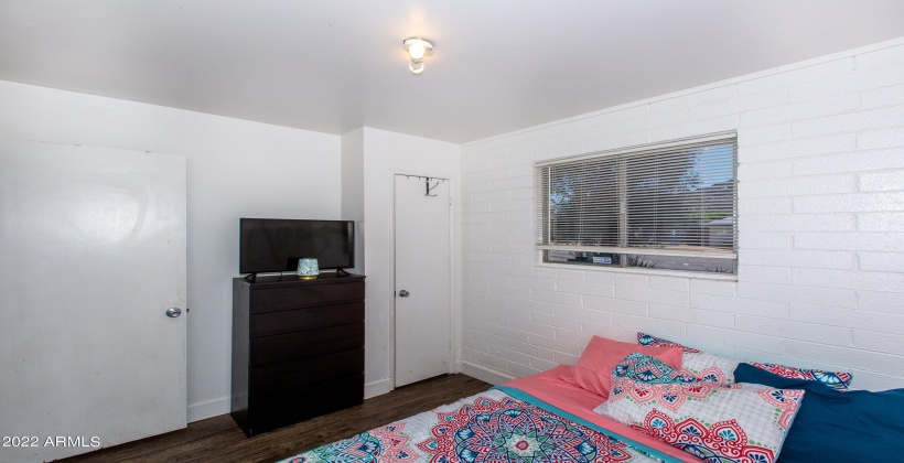 Unit #2 Second Bedroom with large window and closet.