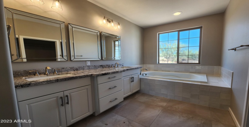 ACTUAL PICTURE OF THE MASTER BATH WITH DUAL SINKS, SEPARATE TUB & SHOWER. GRANITE COUNTERS