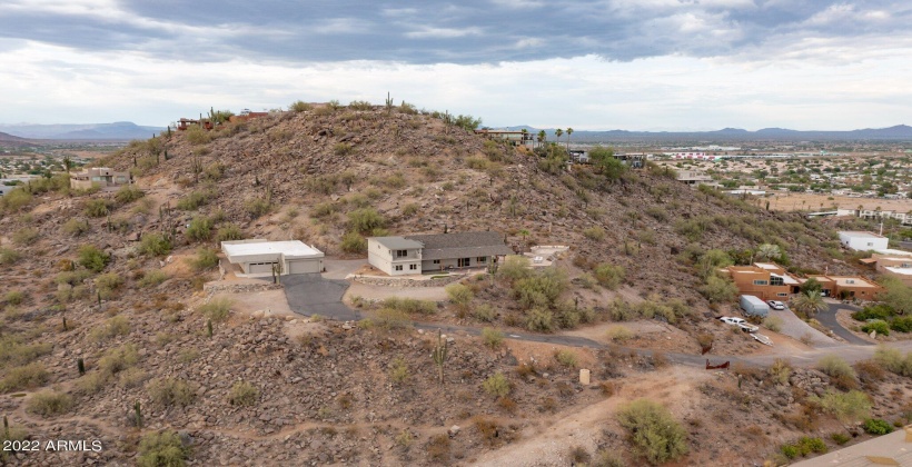 Nestled in the mountain above the surrounding homes for privacy.