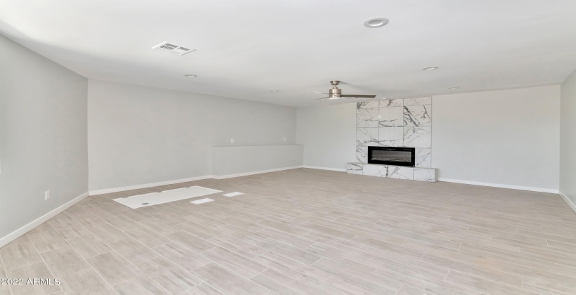 Great Room with Barn door leading to Basement