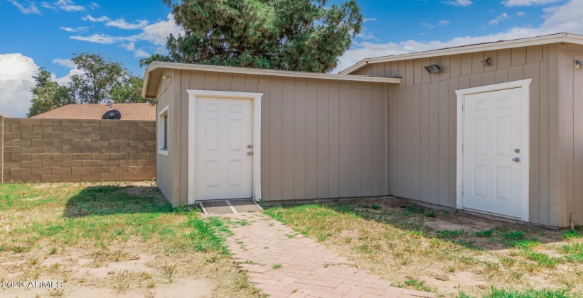 Two sheds - one finiished with wall a/c and one for storage or....