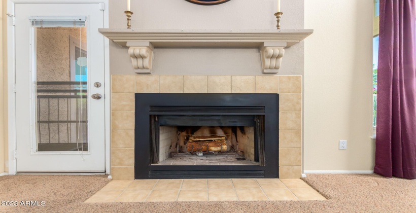 Lovely two-story fireplace and exit to backyard patio from Great Room