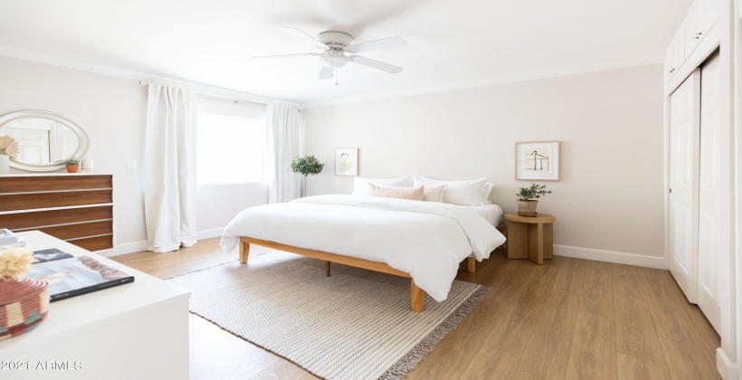 Primary bedroom with king bed, organic sheets and feather duvet.