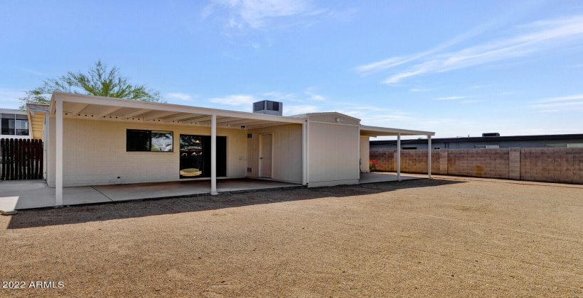 2- Large Covered Patio showing Laundry and Storage in the middle.