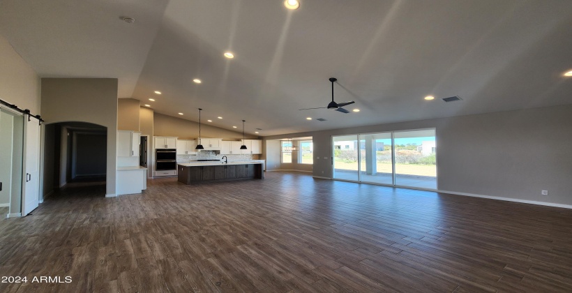 GREAT ROOM LOOKING BACK AT KITCHEN