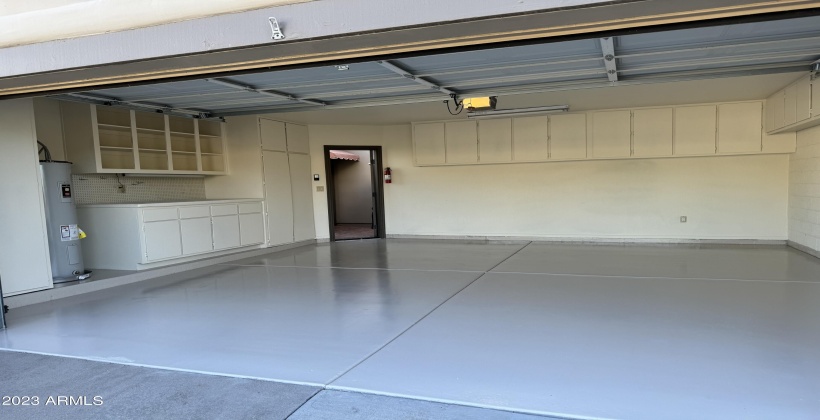 Epoxy floor with built in cabinets and work bench.