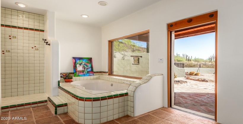 leads to a yet another private patio complete with sitting area and keyhole hacienda theme heavy wooden accent block with wood frame.