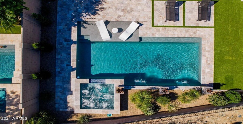 Resort living....Swimming pool with water fountains and elevated spa