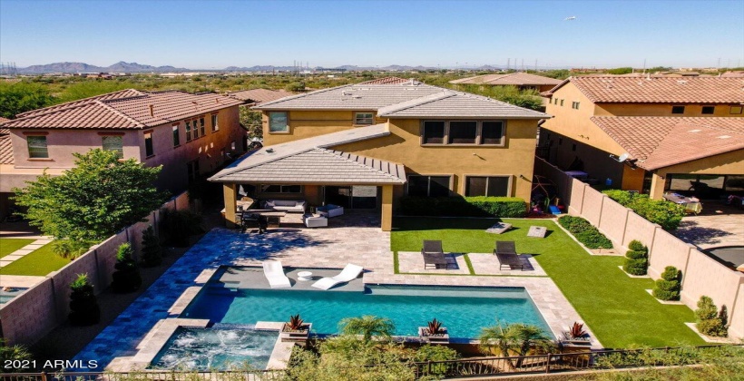 Drone shot of the back yard...no neighbor behind, open to the natural area of open space.