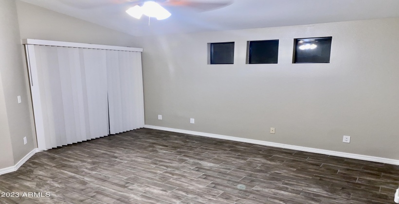 Master Bedroom - Features a Privacy Windows and Sliding Glass Door.