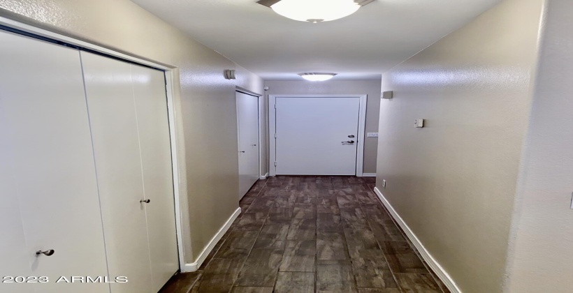 Hallway View with Large Hall Closet and Huge Laundry Area