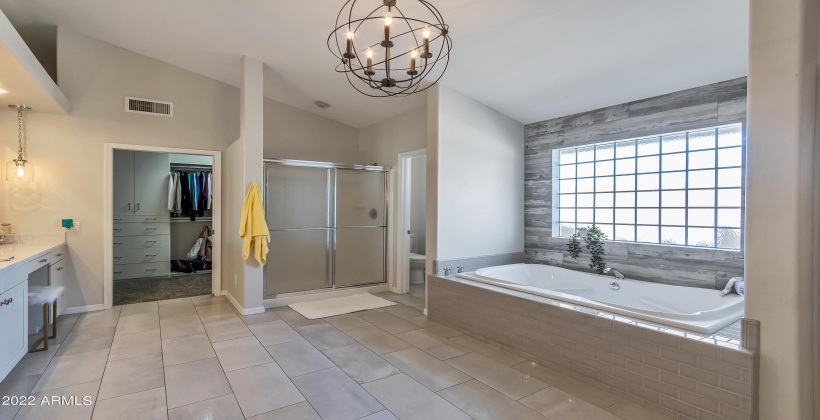 Primary Bathroom with view of one of the primary closets