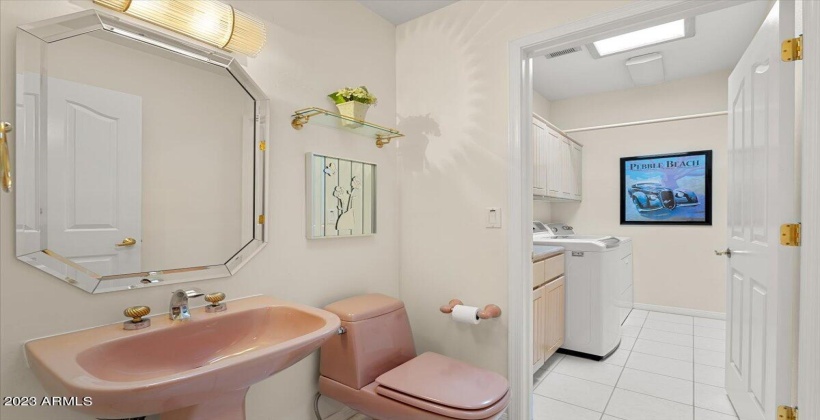 Powder Room connected to spacious Laundry Room