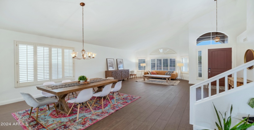 Wonderful plank flooring with large vaulted living spaces