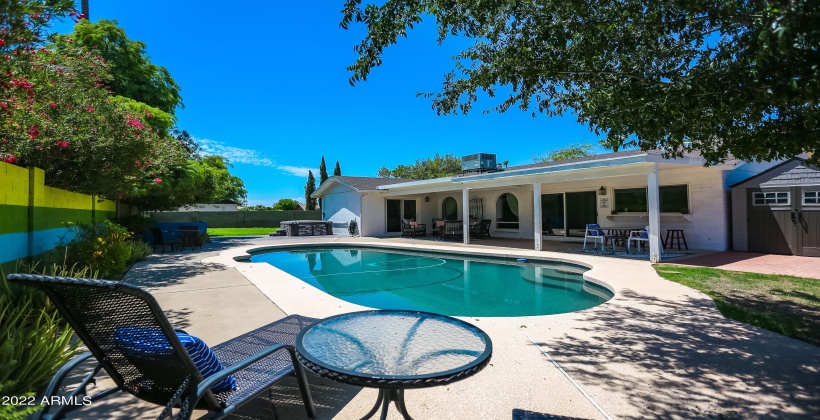 Lounge area, grass, and a fun play pool await!