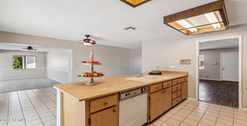 Kitchen opens to spacious addition.