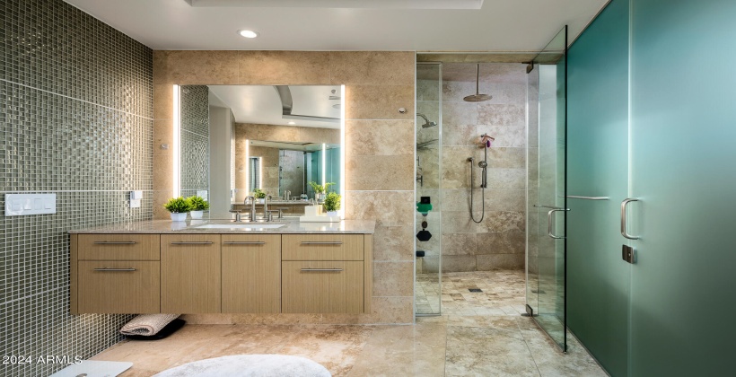 Primary Bathroom featuring Dual Vanity, Stand-in Shower, and Bathtub.