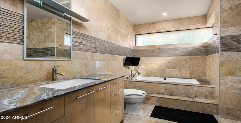 2nd Bedroom En-Suite Bathroom featuring Single Vanity, Bathtub and Stand-In Shower