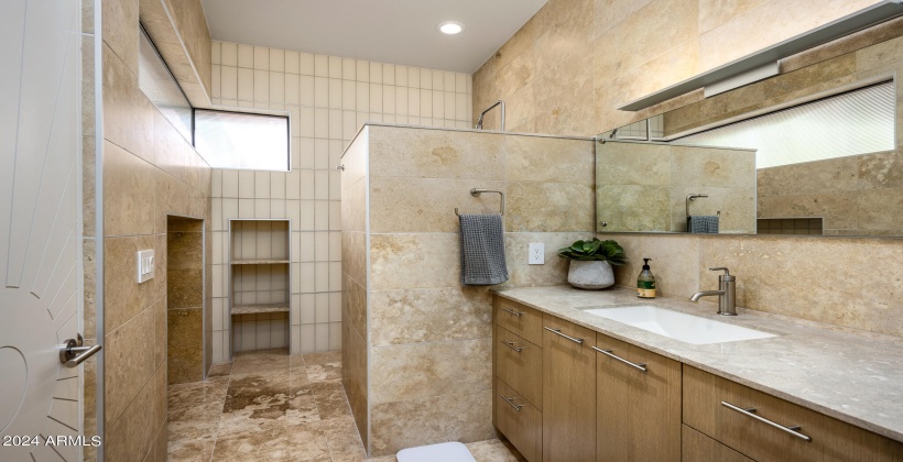 4th Bedroom En-Suite Bathroom featuring single vanity and stand-in shower.