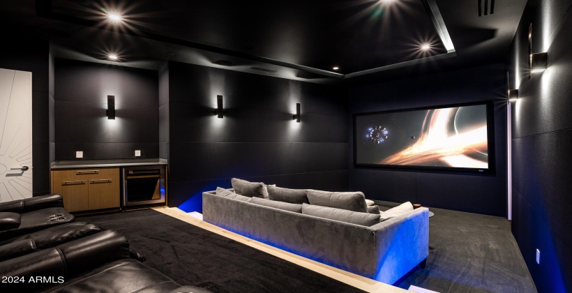 Grand In-Home Theater featuring theater chairs, couch and kitchenette / snack bar.