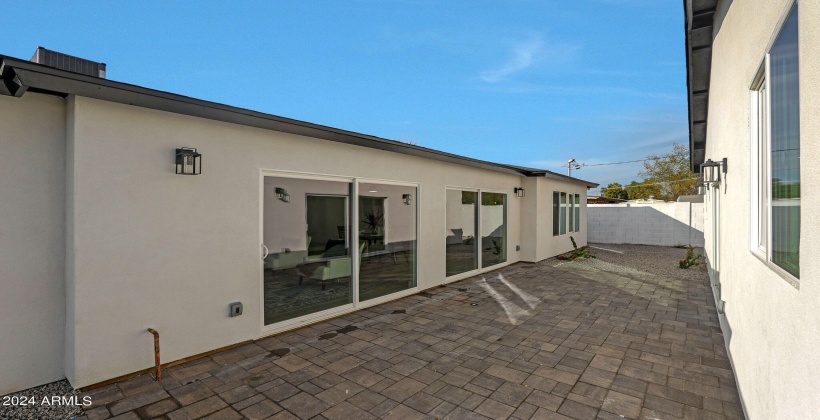 Pavered back patio/courtyard to Guest home