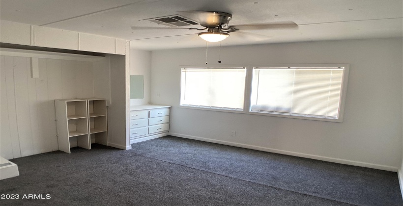 Open closet concept with shoe racks or extra storage for towels, sheets, etc.