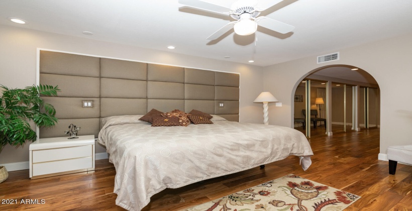 Peaceful, cozy master bedroom with a comfortable tempurpedic sleep number bed.