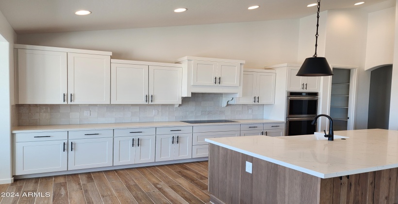 KITCHEN WITH SHAKER STYLE CABINETS (ACTUAL PICTURE OF THE FINISHED HOME AS OF APRIL 7, 2024)