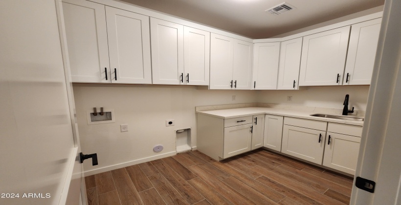 LAUNDRY ROOM (ACTUAL PICTURE OF THE FINISHED HOME AS OF APRIL 7, 2024)