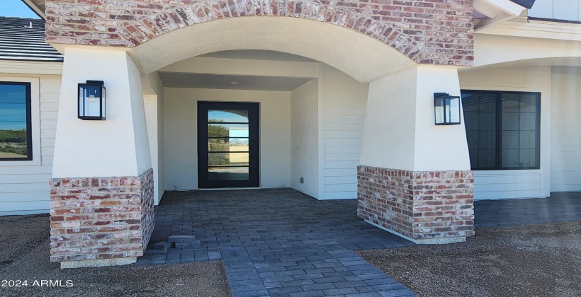 FRONT ENTRY WITH LARGE STEEL DOOR (ACTUAL PICTURE OF THE FINISHED HOME AS OF APRIL 7, 2024)