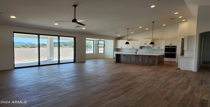 GREAT ROOM LOOKING AT KITCHEN WALK IN CLOSET IN MASTER (ACTUAL PICTURE OF THE FINISHED HOME AS OF APRIL 7, 2024)