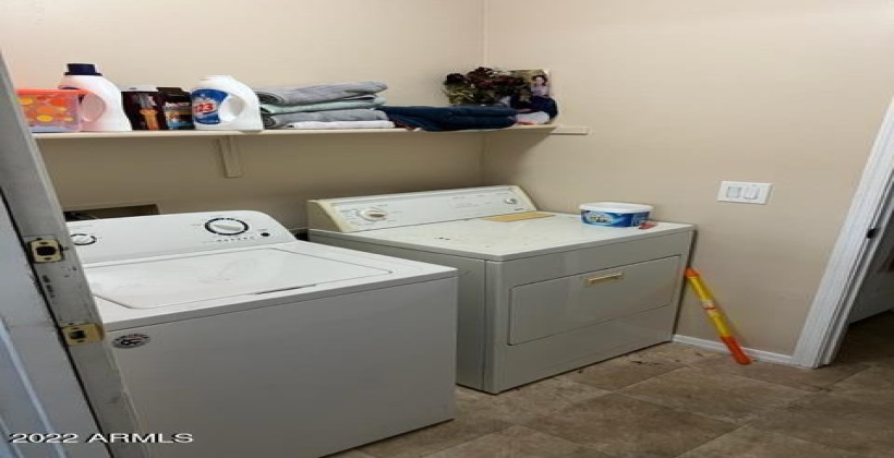 Laundry room is located in the bottom floor.