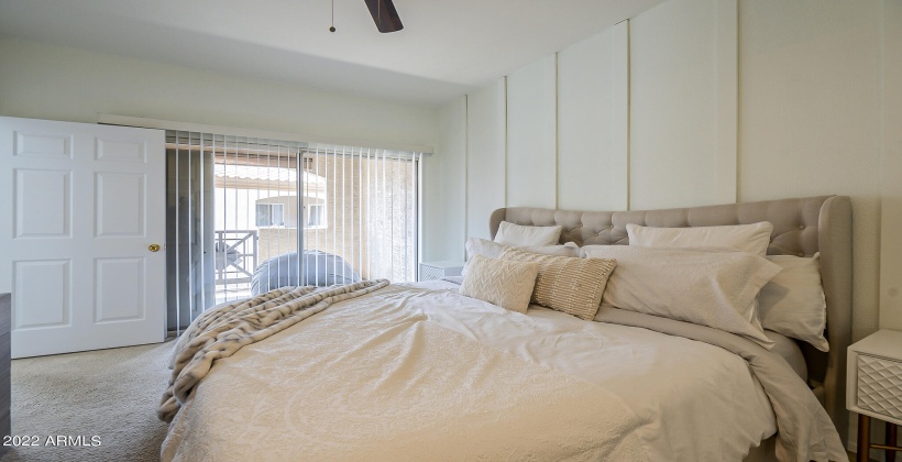 primary bedroom with access to the patio