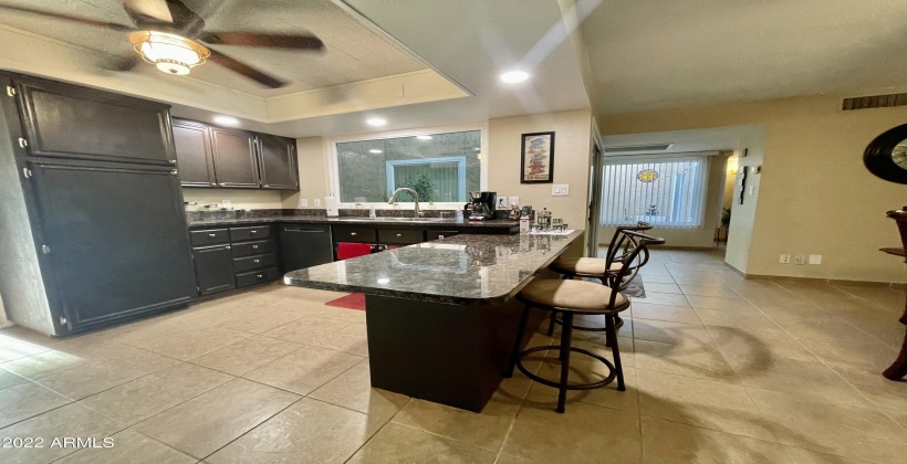 Kitchen island with a large pantry.