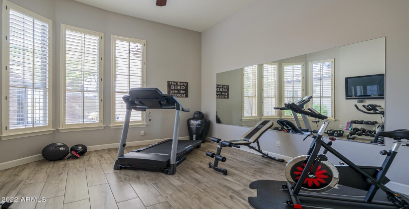 This room on the main level has double doors and could serve as an office or playroom.